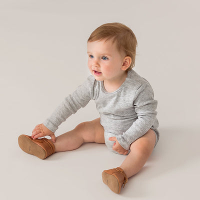 Baby wearing toddler boots in natural colour