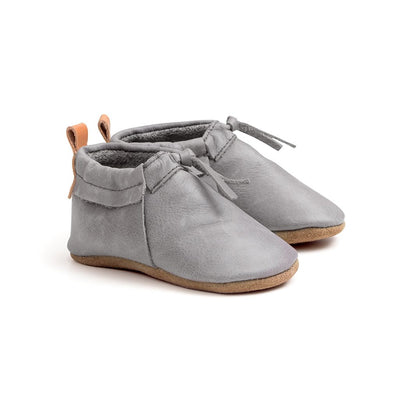 Pair of boots in colour grey